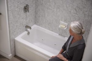 white tub with an elderly woman