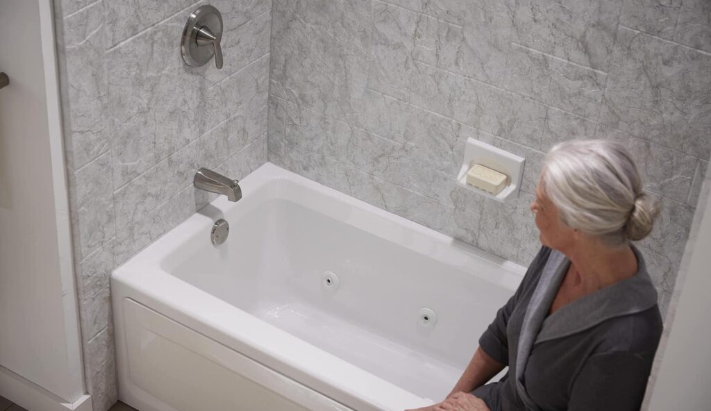 Elderly woman enjoying her bath after it was professionally remodeled in Pelham, AL