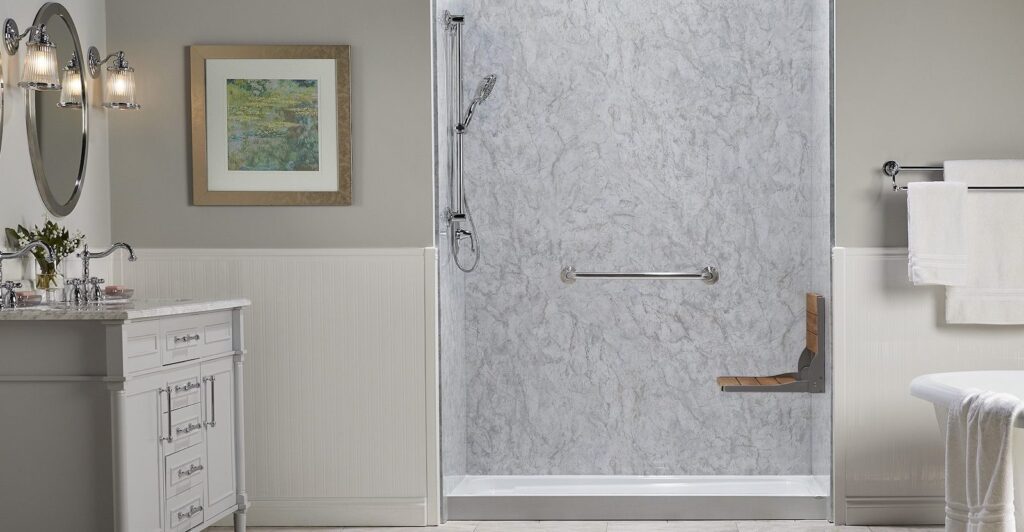 New walk-in shower with shower seat installed during a bathroom remodel.