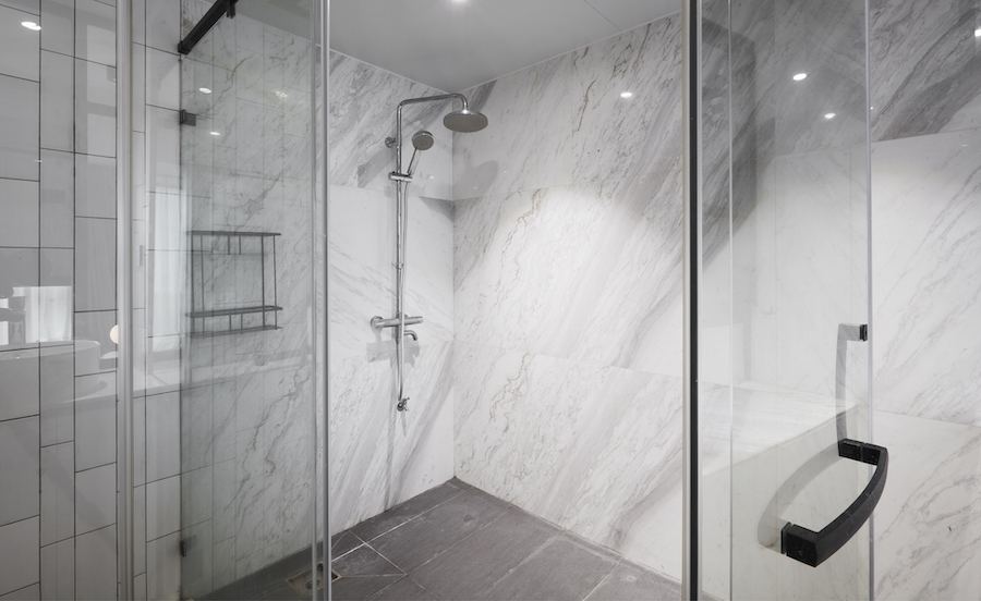 Modern Shower Interior with Marble Walls and Glass
